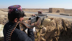 Afghan police in December battled with Taliban fighters in the Helmand Province 