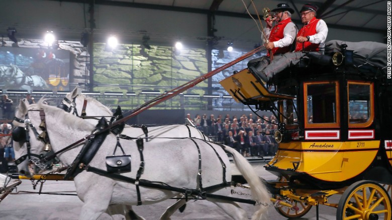 A horses-drawn carriage parades during the opening of the tunnel.