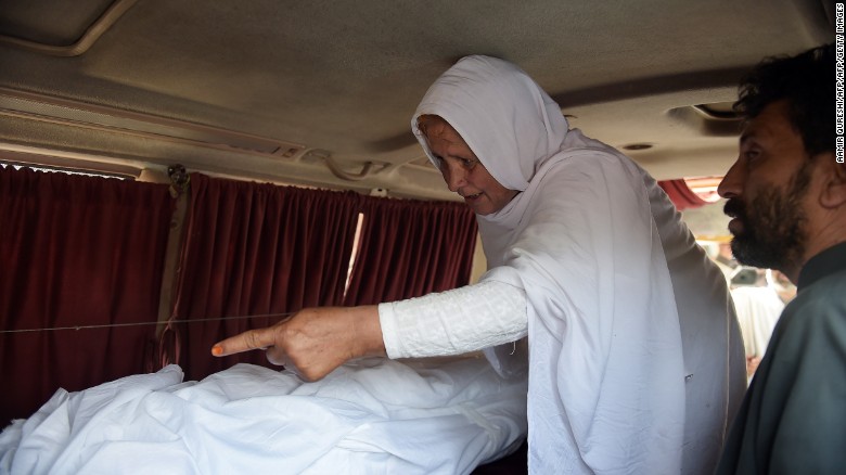 Maria's grandmother mourns next to her body in an ambulance outside a hospital in Islamabad.