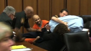 Man lunges at daughter&#39;s killer at sentencing