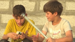 Boys play at the Ahal refugee camp in Abu Graib.