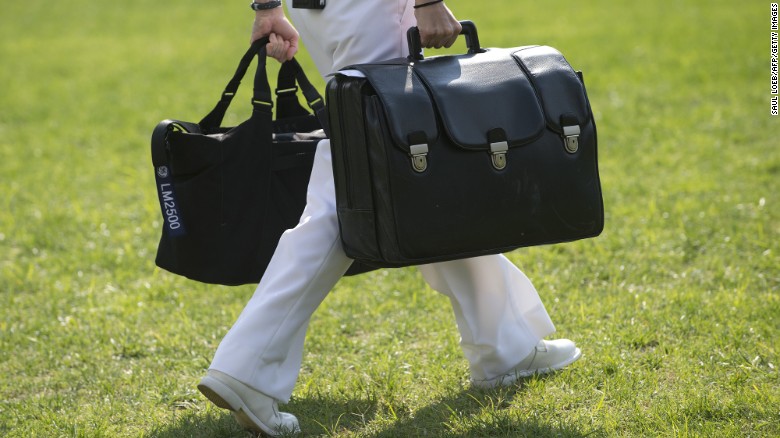 A White House military aide carries a briefcase containing emergency codes.