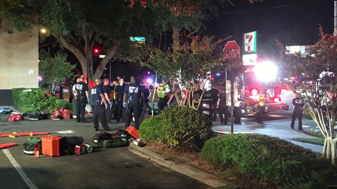 Emergency personnel gather outside the nightclub.