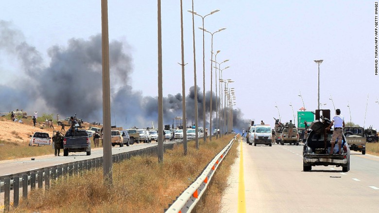 Smoke billows at the entrance of Sirte as forces loyal to Libya&#39;s UN-backed unity government advance to recapture the city from the Islamic State (IS) group jihadists on June 10, 2016. Forces loyal to Libya&#39;s unity government fought streets battles with the Islamic State group as they pressed an offensive to recapture their coastal bastion. The loss of Sirte, the hometown of ousted dictator Moamer Kadhafi, would be a major blow to the jihadists at a time when they are under mounting pressure in Syria and Iraq. / AFP / MAHMUD TURKIA (Photo credit should read MAHMUD TURKIA/AFP/Getty Images)