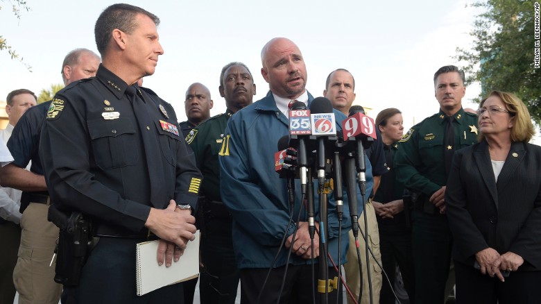Ron Hopper of the FBI answers questions from members of the media on June 12. Listening are Orlando Police Chief John Mina, left, and Orange County Mayor Teresa Jacobs. 