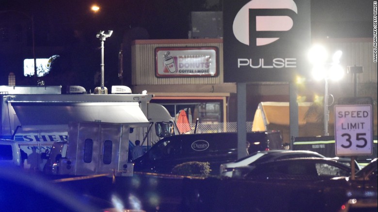  A van from a mortuary is seen in front of the Pulse club in Orlando, Florida, on June 12, as victims&#39; bodies are removed from the scene of the mass shooting. 