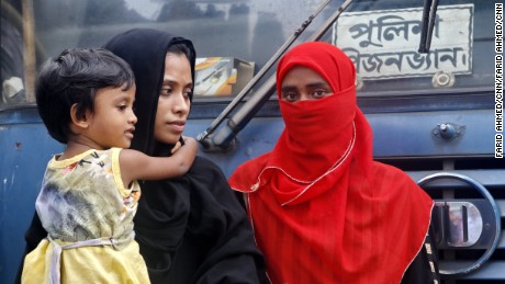 Sanjida Begum (in black veil) waits in front of Dhaka Magistracy to find out where her husband is, after he was detained by city police in Dhaka on Tuesday.