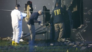 FBI agents investigate near the damaged rear wall of the Pulse Nightclub where Omar Mateen allegedly killed at least 50 people on June 12, 2016 in Orlando, Florida. The mass shooting killed at least 50 people and injuring 53 others in what is the deadliest mass shooting in the country's history.  