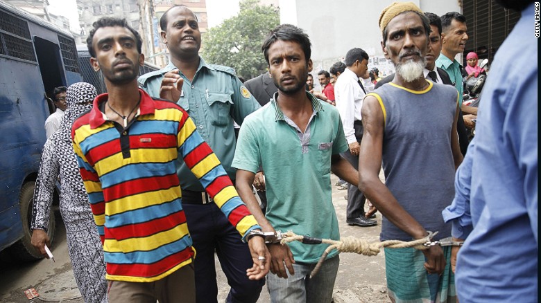 Bangladeshi police escort arrested men  in Dhaka on June 12, 2016. Over 14,000 people, including suspected ordinary criminals, have been detained after police launched a controversial anti-militant drive across the Muslim-majority nation following a spate of gruesome murders. 