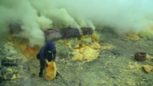 The chalky mineral builds up around vents that belch out yellow smoke from inside the volcano.
