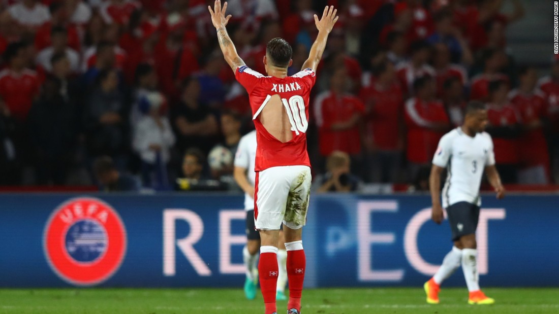 Granit Xhaka of Switzerland shows his ripped PUMA shirt during the Euro 2016 Group A match between Switzerland and France in Lille on Sunday.