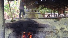 Wood-fired ovens heat giant cauldrons where workers melt chunks of sulfur ore down to a liquid.