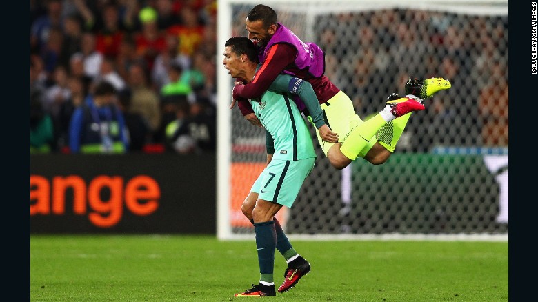 Eduardo jumps to his teammate Cristiano Ronaldo as Portugal celebrates their 1-0 win over Croatia on Saturday, June 25, 2016 at the Bollaert-Delelis stadium in Lens, France. 