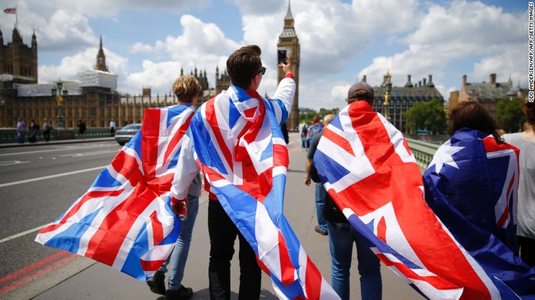 People walk over Westminster Bridge wrapped in Union flags, towards the Queen Elizabeth Tower (Big Ben) and The Houses of Parliament in central London on June 26, 2016. 

Britain's opposition Labour party plunged into turmoil Sunday and the prospect of Scottish independence drew closer, ahead of a showdown with EU leaders over the country's seismic vote to leave the bloc. Two days after Prime Minister David Cameron resigned over his failure to keep Britain in the European Union, Labour leader Jeremy Corbyn faced a revolt by his lawmakers who called for him, too, to quit.

 / AFP / Odd ANDERSEN        (Photo credit should read ODD ANDERSEN/AFP/Getty Images)