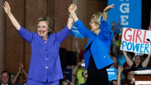 Hillary Clinton and U.S. Sen Elizabeth Warren wave to the crowd before a campaign rally on June 27, 2016 in Cincinnati, Ohio.