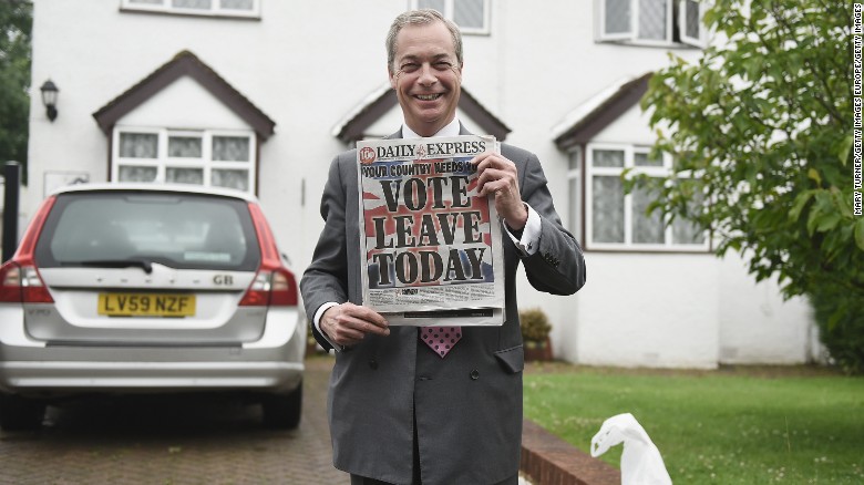 Nigel Farage holds up the Daily Express on June 23, as Brits voted in the referendum.