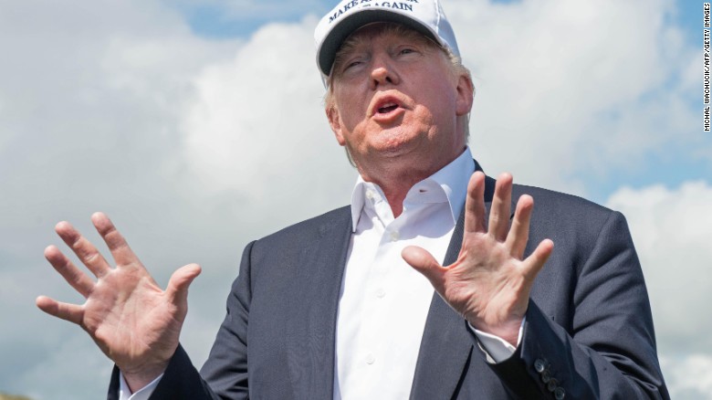 Presumptive Republican presidential nominee Donald Trump speaks to members of the media during a tour of his International Golf Links course north of Aberdeen on the east coast of Scotland on June 25, 2016.