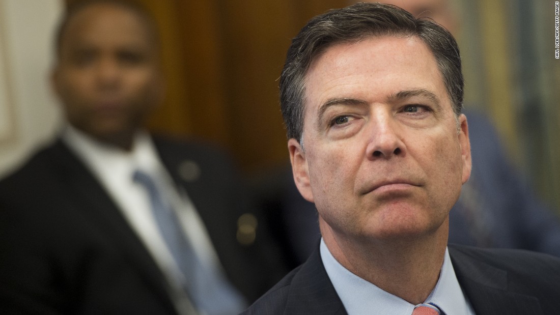 Comey sits with critics at ceremony for late colleague