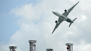 An Airbus A350 XWB flies past during the Singapore Airshow at Changi exhibition center in Singapore on February 16, 2016. AFP PHOTO / ROSLAN RAHMAN / AFP / ROSLAN RAHMAN        (Photo credit should read ROSLAN RAHMAN/AFP/Getty Images)