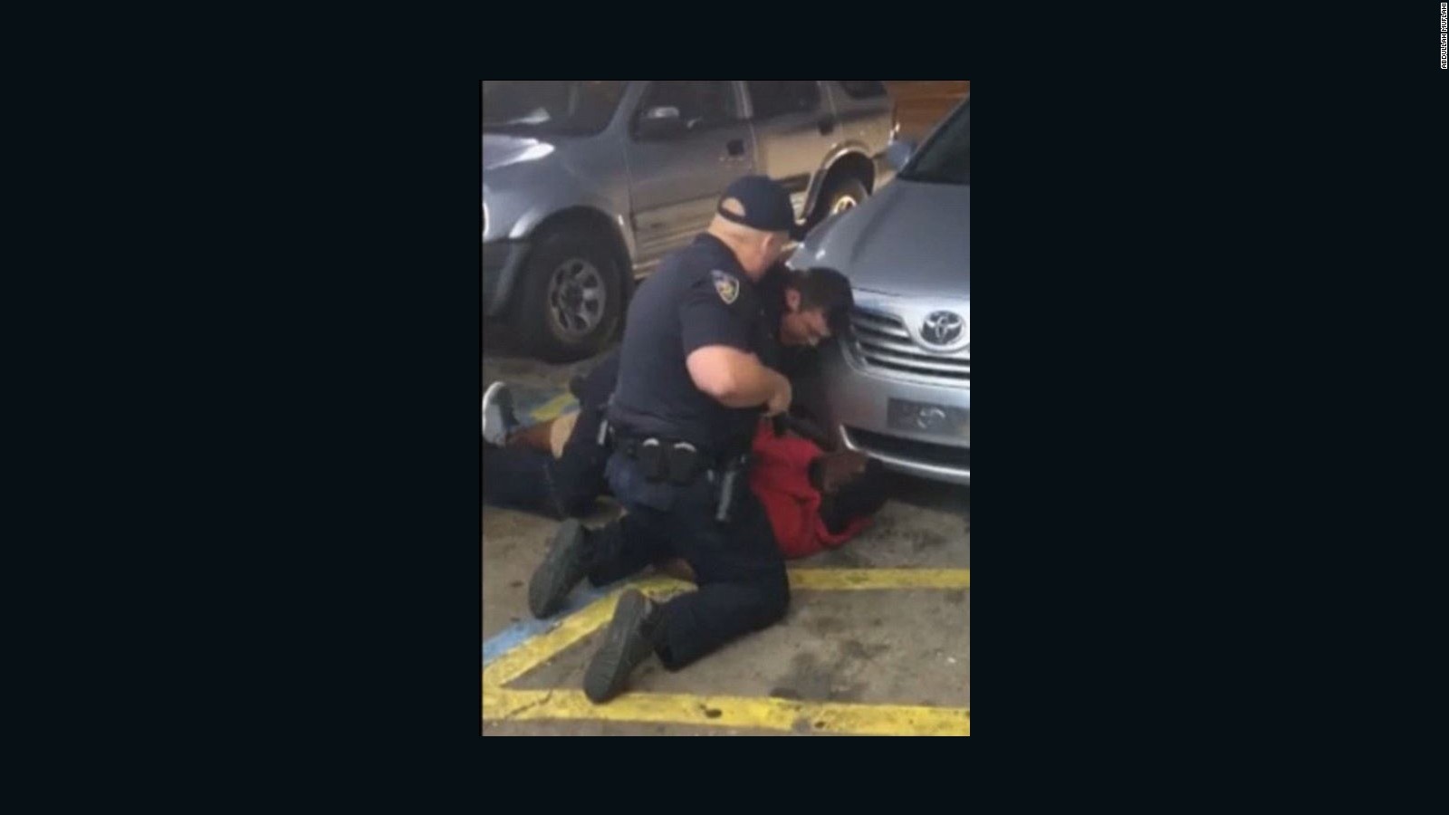 A still image taken from a bystander video of Baton Rouge police officers tackling Alton Sterling before he was fatally shot.