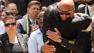 People line up to hug police officers in Dallas