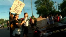 MINNEAPOLIS (WCCO) ? A group of protesters marched onto Interstate 94 Saturday evening, stopping traffic in both directions.