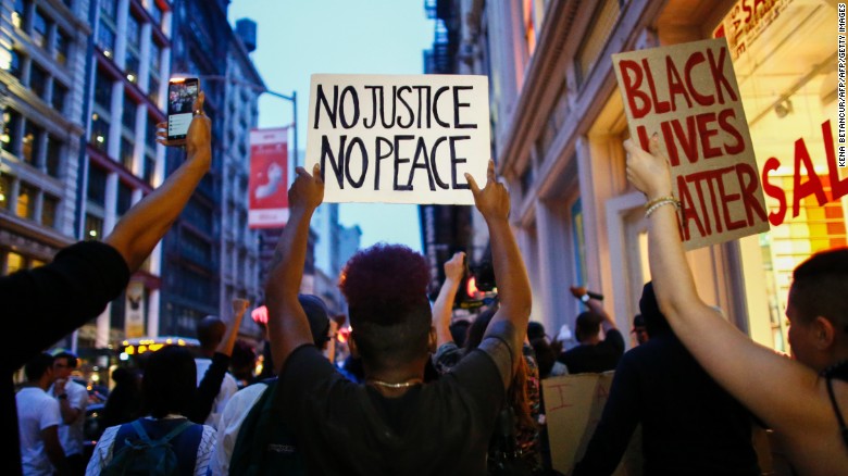 People shout slogans during a protest in support of the Black lives matter movement in New York on July 09, 2016. 
The gunman behind a sniper-style attack in Dallas was an Army veteran and loner driven to exact revenge on white officers after the recent deaths of two black men at the hands of police, authorities have said. Micah Johnson, 25, had no criminal history, Dallas police said in a statement. / AFP / KENA BETANCUR        (Photo credit should read KENA BETANCUR/AFP/Getty Images)