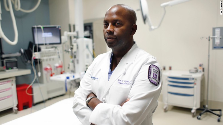 Dr. Brian H. Williams, a trauma surgeon at Parkland Memorial Hospital, poses for a photo at the hospital, Monday, July 11, 2016, in Dallas. Williams treated some of the Dallas police officers who were shot Thursday night in downtown Dallas.