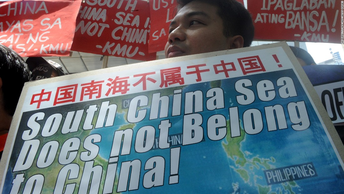 A protestor holds a placard at a rally in front of the Chinese Consulate in Manila&#39;s financial district on July 7, 2015, denouncing China&#39;s claim to most of the South China Sea including areas claimed by the Philippines. The protest comes as a UN tribunal in the Hague begins a hearing on a Philippine suit challenging China&#39;s claim over disputed islands in the South China Sea. The Philippines has become increasingly vocal in criticising China&#39;s aggressiveness in staking its claim, including the building of artificial islands using reclaimed land in the disputed waters. AFP PHOTO / Jay DIRECTO (Photo credit should read JAY DIRECTO/AFP/Getty Images)