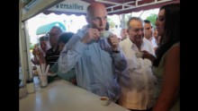 Florida Gov. Rick Scott drinks a Cuban coffee at Versailles Restaurant in Miami during a visit to celebrate the eatery's 40th anniversary in 2011. The restaurant is where U.S. presidents, governors and other politicians come to court the Cuban exile vote.