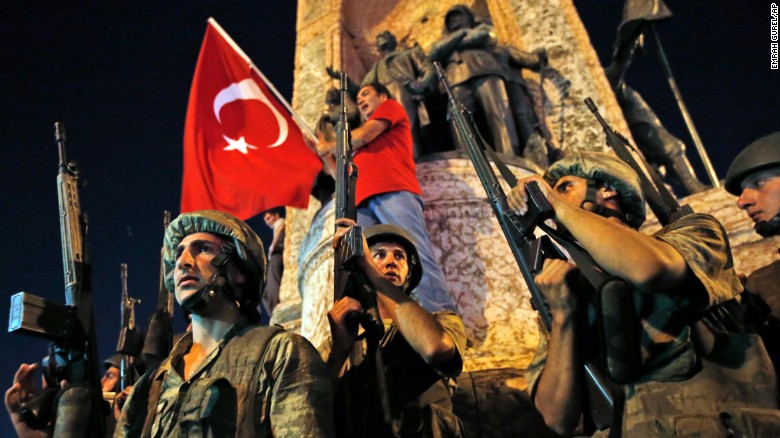 Turkish soldiers secure the area as supporters of Turkey&#39;s President Recep Tayyip Erdogan protest in Istanbul&#39;s Taksim square, early Saturday, July 16, 2016. Turkey&#39;s prime minister says a group within Turkey&#39;s military has engaged in what appeared to be an attempted coup. Binali Yildirim told NTV television: &quot;it is correct that there was an attempt.&quot;