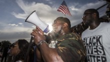 Demonstrators gather after marching on July 9 at the Louisiana Capitol in Baton Rouge to protest the shooting of Alton Sterling. 