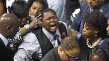 Alton Sterling's son Cameron cries as he precedes his father's casket after the funeral for his father at the F.G. Clark Activity Center in Baton Rouge on July 15. 