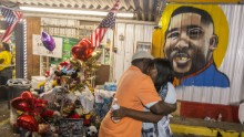 Sandra Sterling, Alton Sterling's aunt, visits the memorial for him at the Triple S Food Mart in Baton Rouge, Louisiana, on July 7.