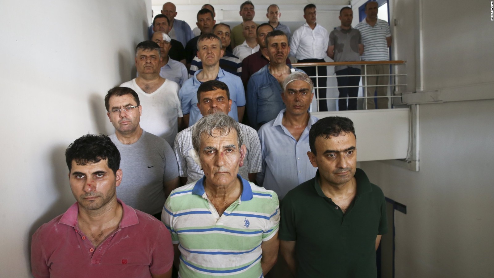 Akin Ozturk (center, first row) appears in a picture, which has been verified by CNN, which shows some of the 27 men accused by the Erdogan government of having led Friday's failed coup in Turkey.