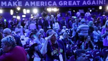 Bob Little, from Warren, Michigan, salutes as he watches a presentation on Monday.