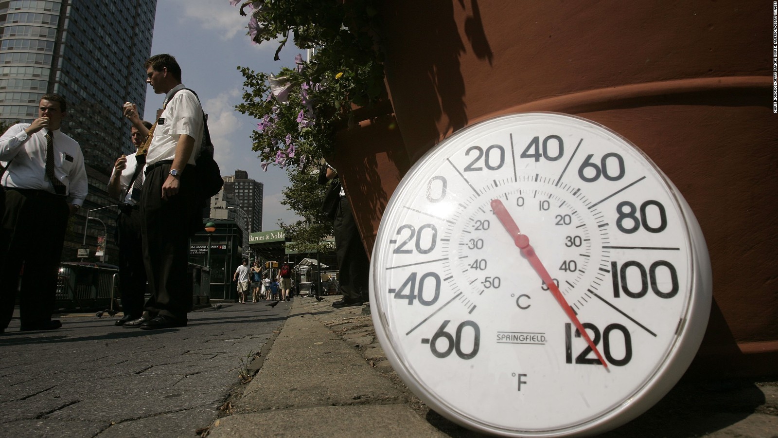 NEW YORK - AUGUST 02: A thermometer in the sun on the sidewalk indicates a temperature of 120 degrees Fahrenheit as people eat ice cream on the Upper West Side August 2, 2006 in New York City. Forecasters have called for high temperatures of 100 degrees in the city with the heat wave continuing through tomorrow. (Photo by Chris Hondros/Getty Images)