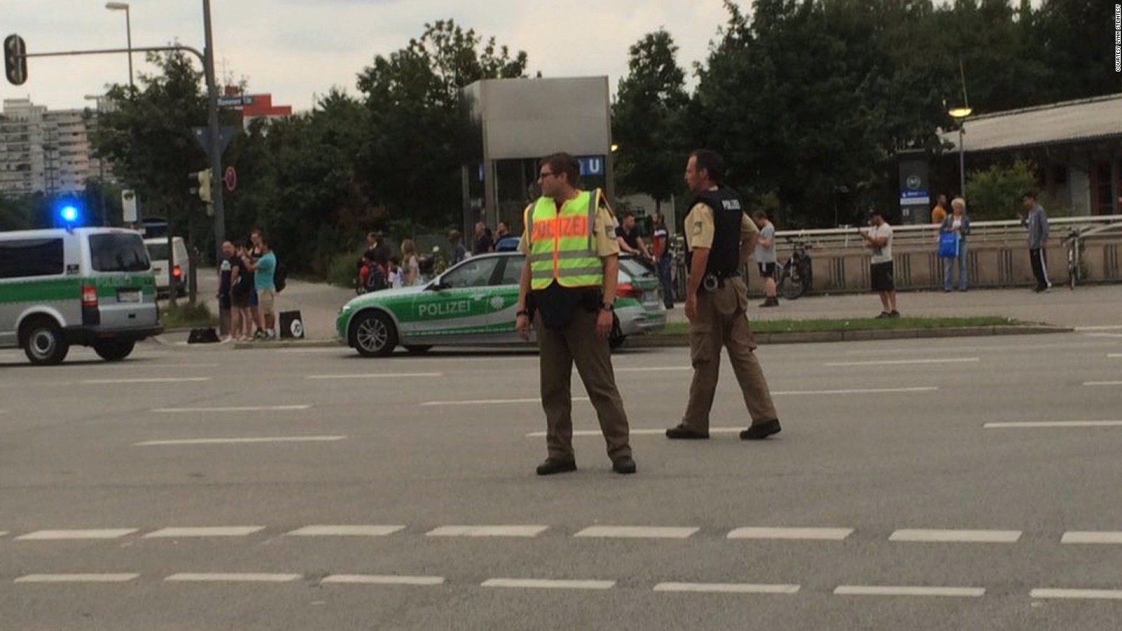 Police respond to a shooting outside the Olympia shopping mall in Munich.