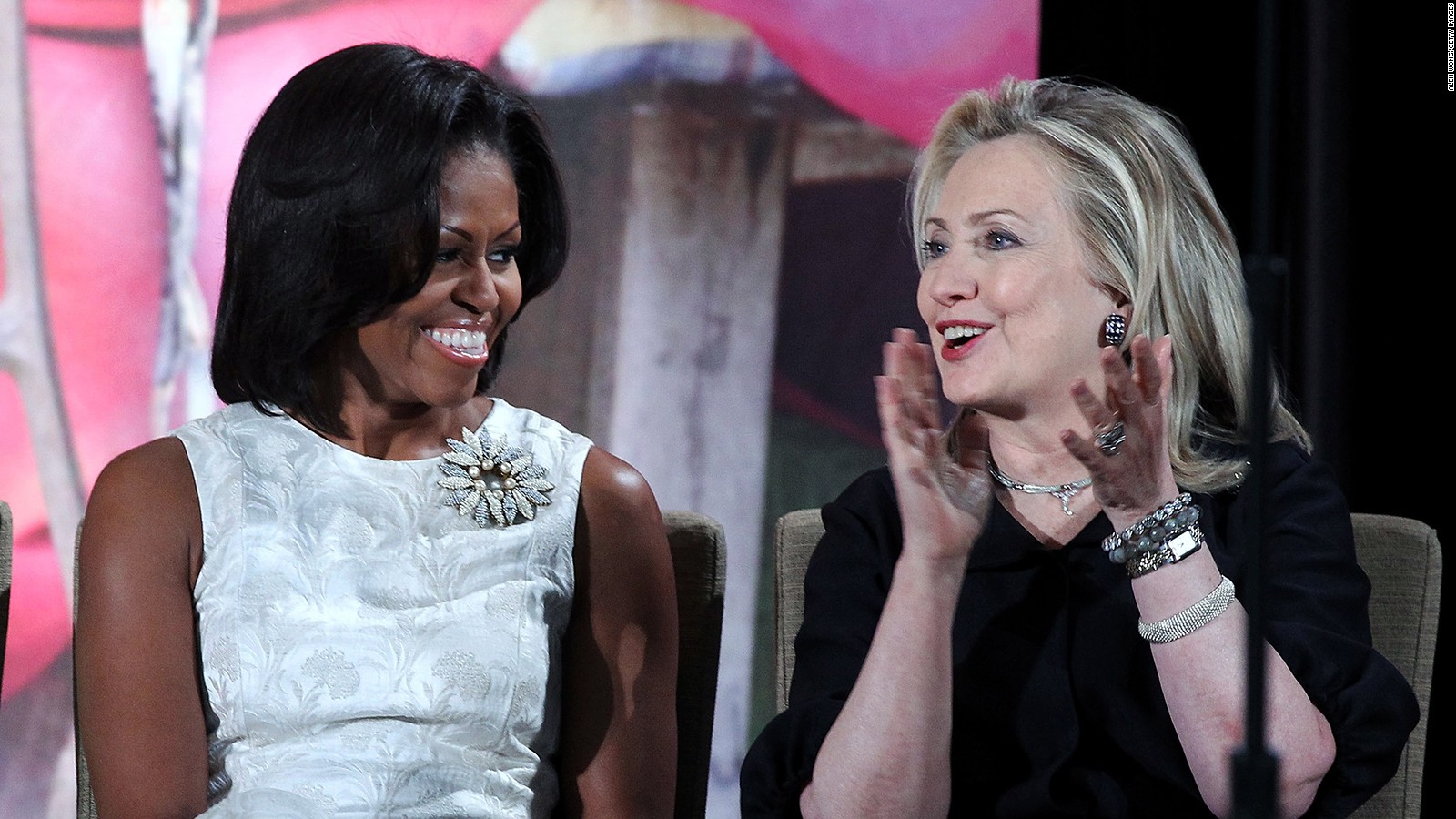 First lady Michelle Obama (L) listens to U.S. Secretary of State Hillary Clinton during the presentation ceremony of the International Women of Courage Awards at the State Department March 8, 2012 in Washington, DC.