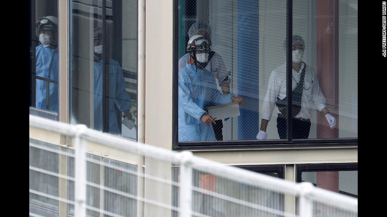 Rescue workers are seen at the Tsukui Yamayuri En care center 