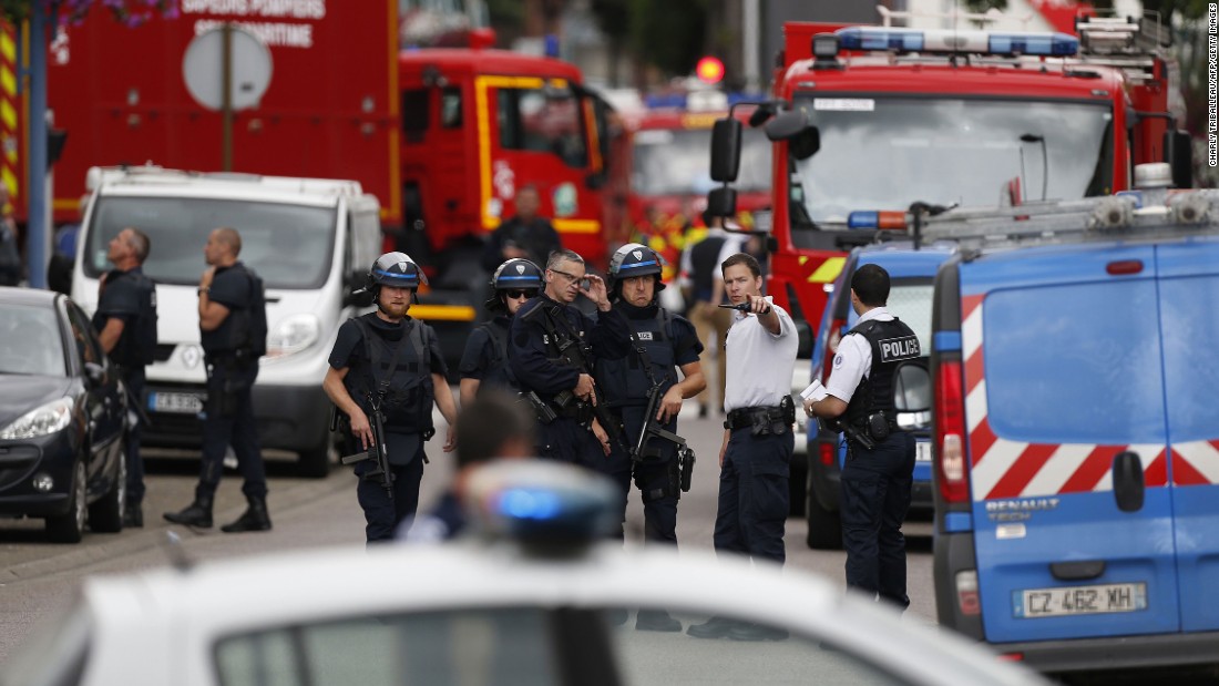 Police and firemen arrive at the scene of the attack.
