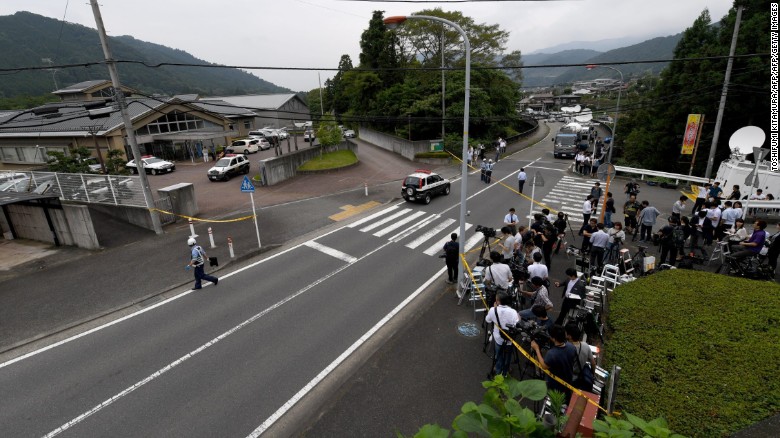 Journalists gather across the street from the Tsukui Yamayuri En care centre.