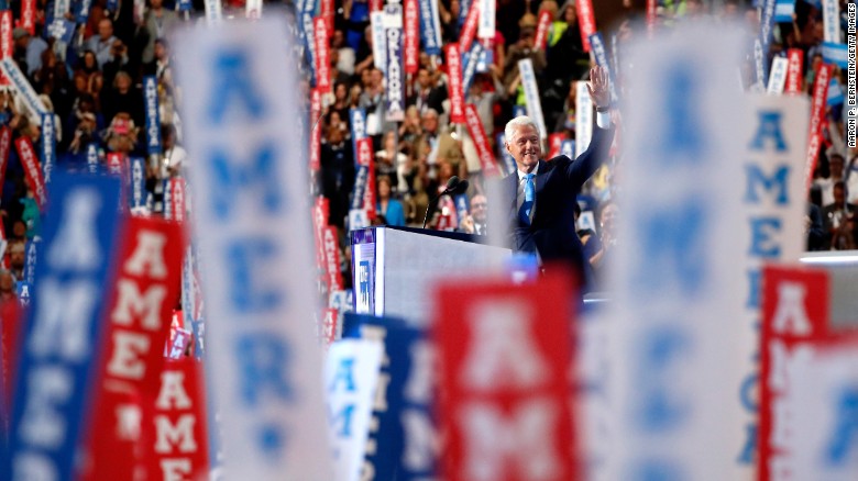 Former US President Bill Clinton waves to the crowd as he arrives on stage to deliver remarks on the second day of the Democratic National Convention at the Wells Fargo Center, July 26, 2016 in Philadelphia, Pennsylvania. Democratic presidential candidate Hillary Clinton received the number of votes needed to secure the party's nomination. An estimated 50,000 people are expected in Philadelphia, including hundreds of protesters and members of the media. The four-day Democratic National Convention kicked off July 25.