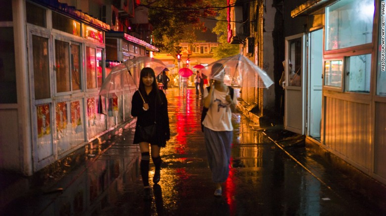 Night scene in a traditional Beijing Hutong. Many of these narrow alleyways have stood since the 13th century, the time of the Yuan Dynasty. 