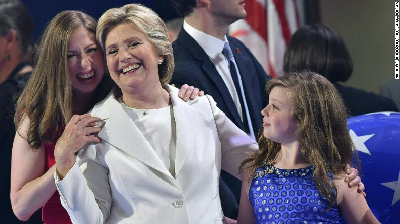 Democratic presidential nominee Hillary Clinton and her daughter Chelsea (L) celebrate on the fourth and final night of the Democratic National Convention at Wells Fargo Center on July 28, 2016 in Philadelphia, Pennsylvania. / AFP / Nicholas Kamm (Photo credit should read NICHOLAS KAMM/AFP/Getty Images)