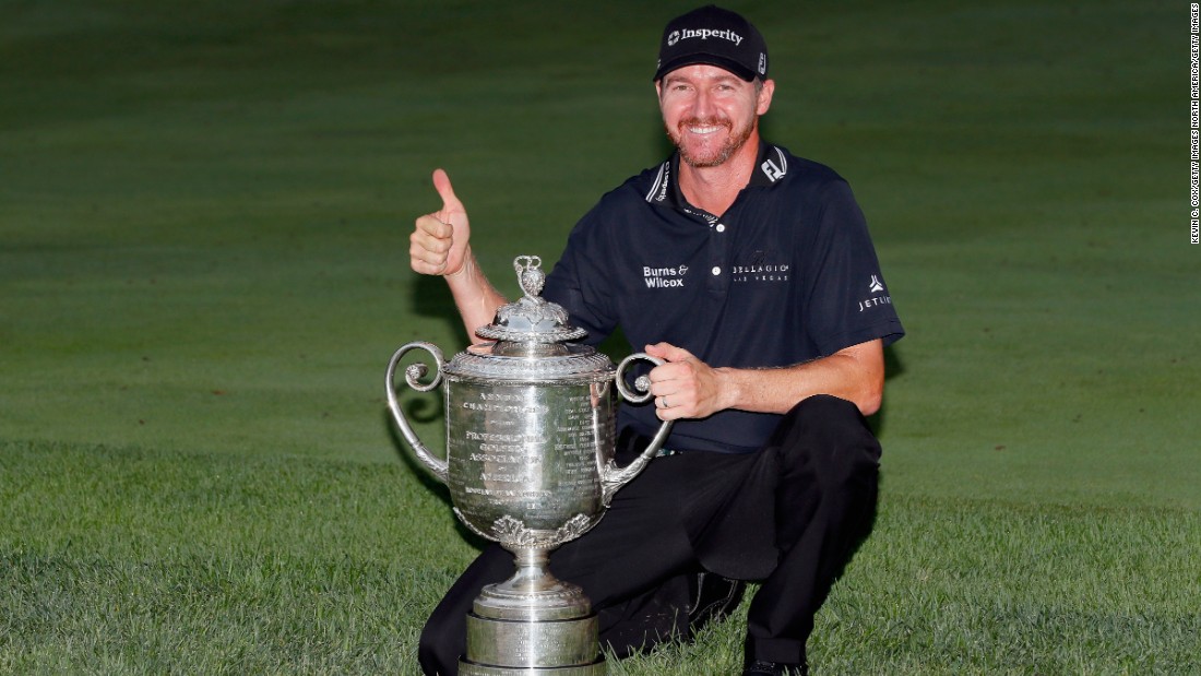 Jimmy Walker poses with the PGA Championship trophy, his first major title.