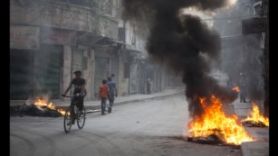 Residents burned tires and other materials to start fires in eastern Aleppo, to obscure the vision of pilots looking to drop bombs on neighborhoods.