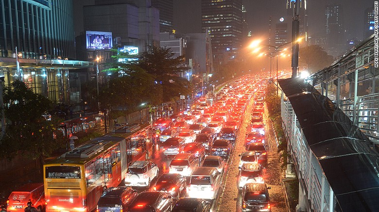 Motorists trespass in the bus lane, forcing a bus into traffic during the city&#39;s peak rush hour in Jakarta, on November 13, 2015. 