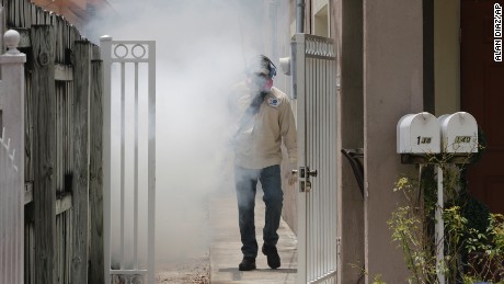 What are mosquito-control workers spraying in Miami?