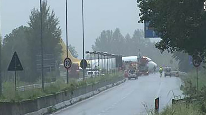A cargo plane skidded off the runway and into the road at the Bergamo Orio al Serio Airport in Italy. 